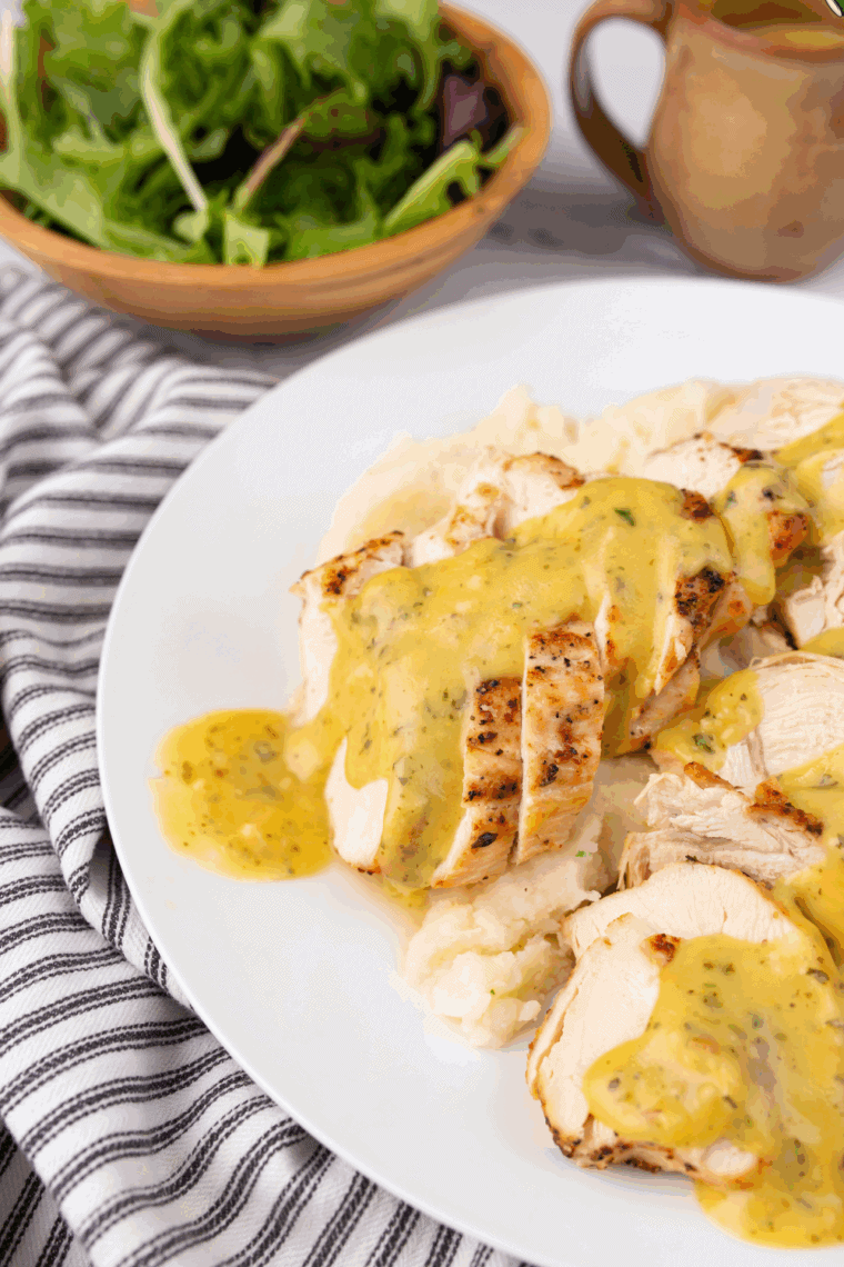 Bowl of creamy Applebee’s honey mustard sauce with spoon ready for dipping.