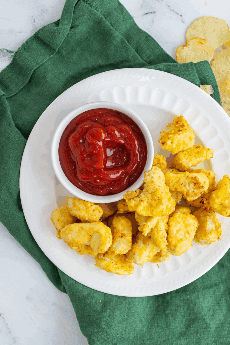 Homemade Arby’s Bronco Berry Sauce in a dipping bowl with jalapeño poppers