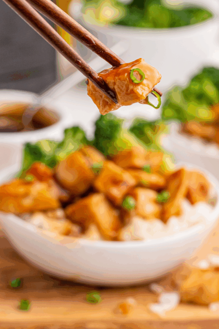 Juicy chipotle honey chicken thighs glazed with honey and garnished with fresh cilantro on a serving plate.
