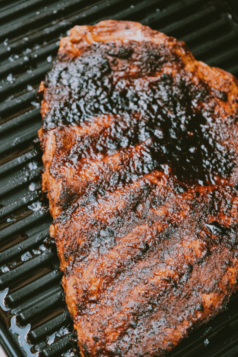Homemade A&W BBQ sauce in a bowl with a basting brush