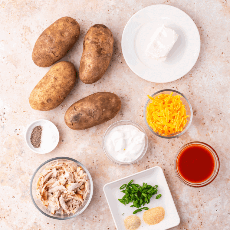 Ingredients needed for Easy Mexican Stuffed Baked Potatoes on kitchen table.