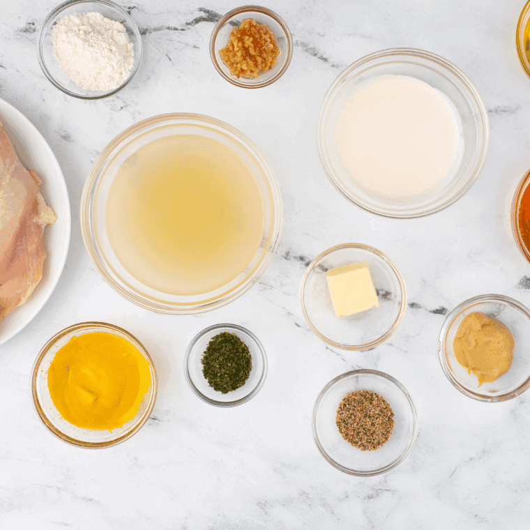 Ingredients needed for Hardees Honey Mustard Recipe on kitchen table.