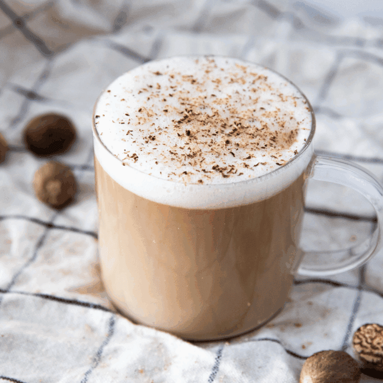 Ninja Creami Copycat McDonald’s Frappe Recipe in glass with whipped cream and shaved chocolate.