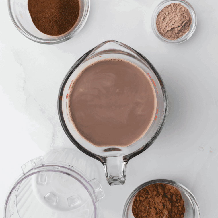 Ingredients needed for Ninja Creami McDonald’s Chocolate Milkshake on kitchen table.