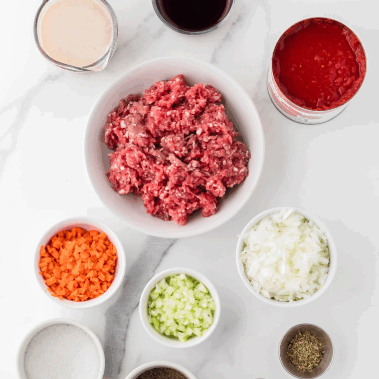 Ingredients needed for Ninja Foodi Possible Cooker Pro Bolognese Sauce on kitchen table.
