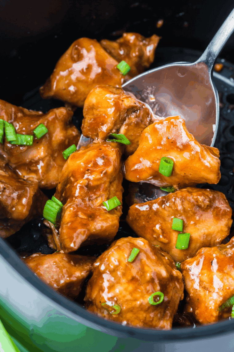 Plate of Panda Express-style grilled teriyaki chicken with glossy sauce and steamed rice.