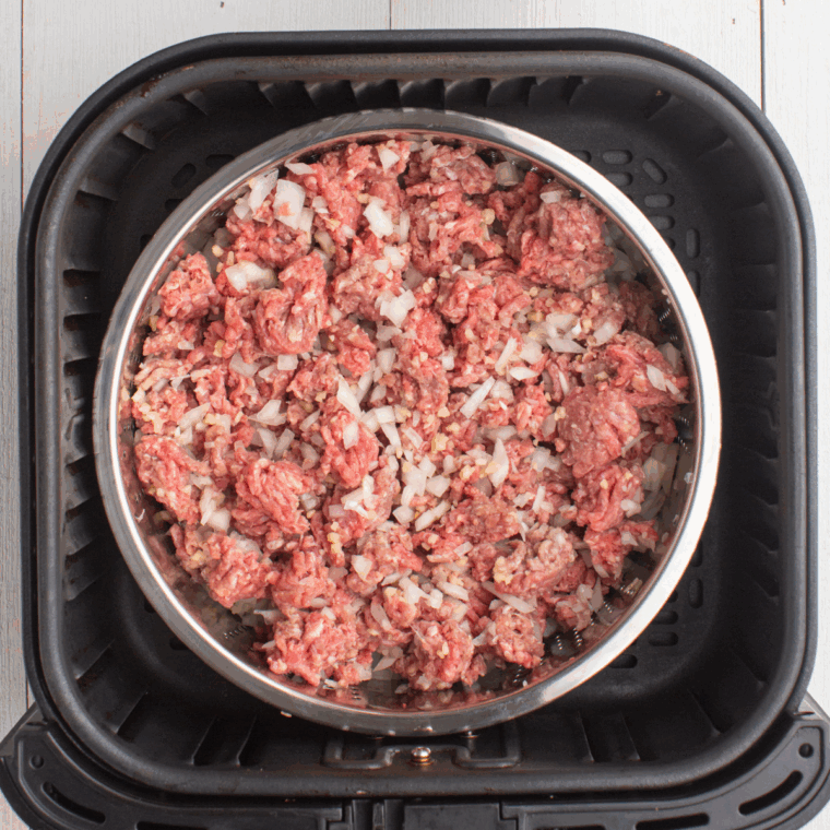 Place raw ground beef with seasoning in a small baking pan.
