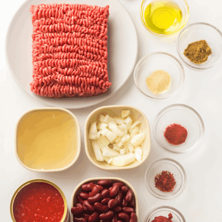 Ingredients needed for Texas Roadhouse Chili Recipe on kitchen table.