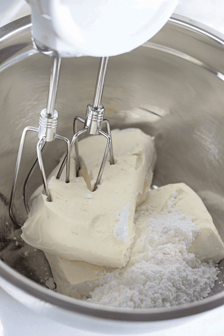 Beating cream cheese and powdered sugar until smooth in a mixing bowl.