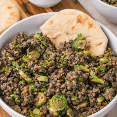 Transfer the Brussels sprouts to a large bowl and mix in the steamed lentils. Pour in the Trader Joe’s Organic Toasted Sesame Dressing and give it all a good toss to coat. Serve warm for a delicious and nutritious salad that’s ready in minutes!