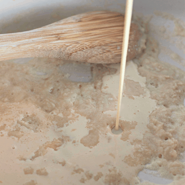 Melted butter and flour whisked in a saucepan to form a golden roux for cheese sauce.