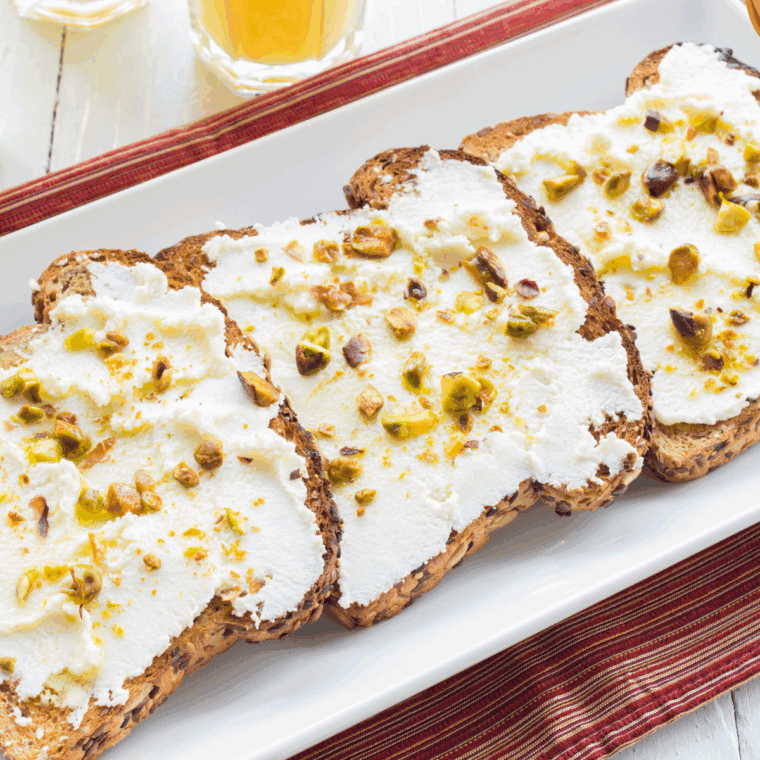 Cheesecake Factory-style ricotta cheese toast topped with honey and fresh berries.