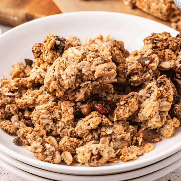 Crunchy fruit and nut granola clusters on a baking sheet