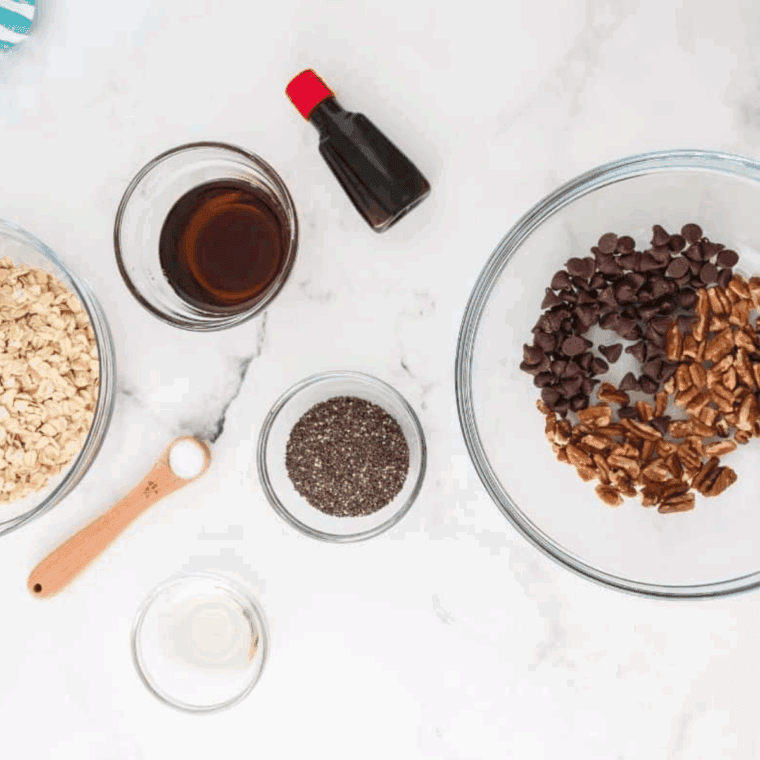 Ingredients needed for Copycat Quaker Chewy Chocolate Chip Granola Bars on kitchen table.