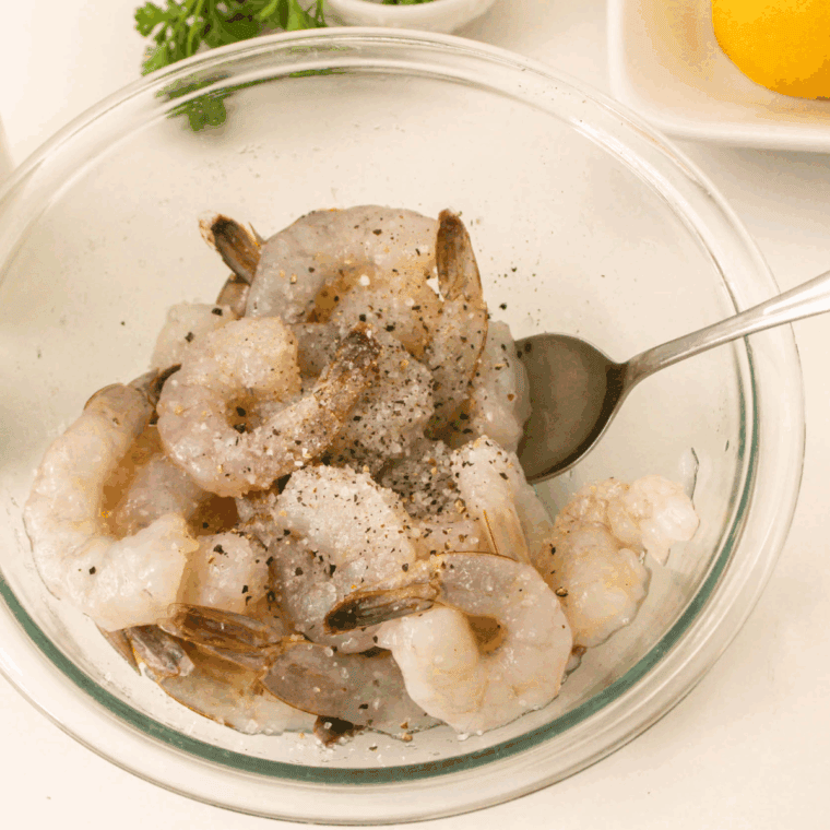 Toss Shrimp with seasonings in a small mixing bowl.