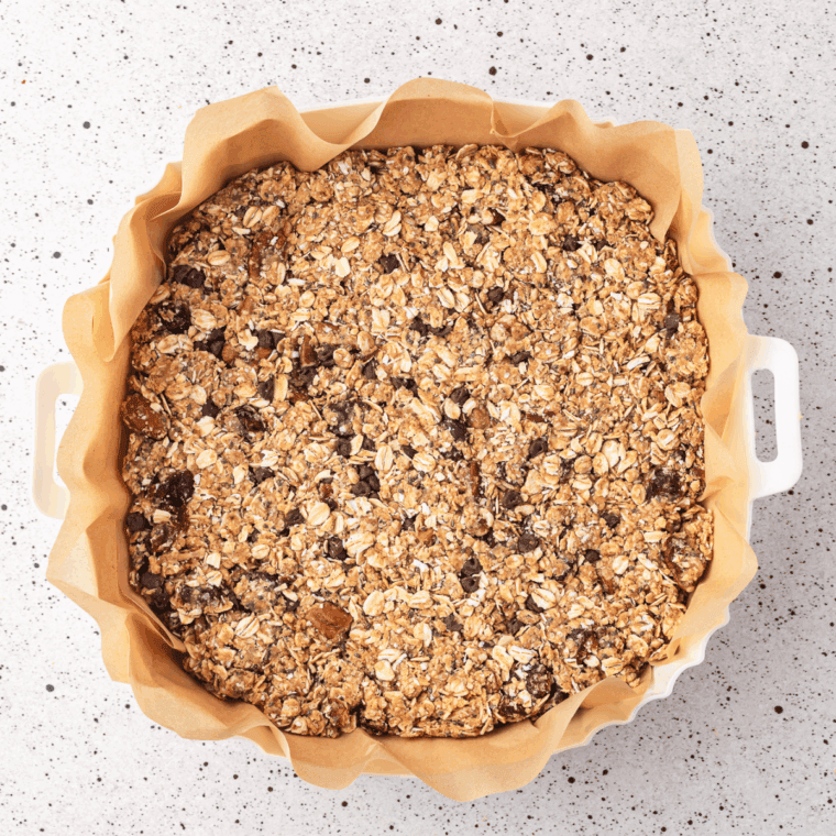 Homemade Honey Bunches of Oats copycat cereal with oat clusters, cornflakes, and almonds in a bowl.