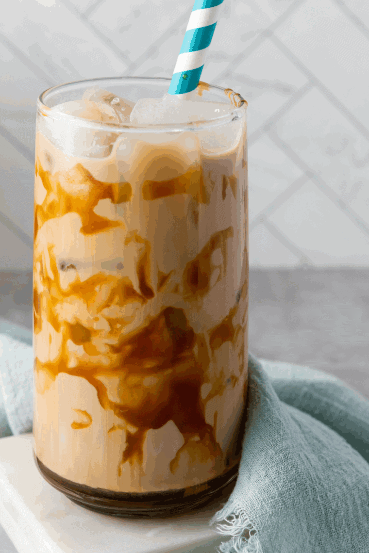 Homemade Jack in the Box Creamaccino in a clear cup with whipped cream on top.