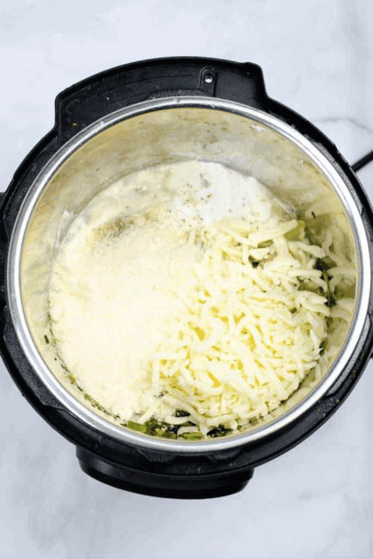 Cooked Longhorn Steakhouse Copycat Parmesan Crusted Spinach Dip in the Instant Pot or pressure cooker.