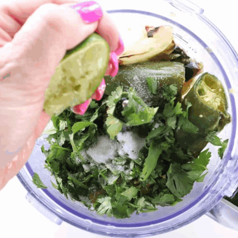 Roasted tomatillos, garlic, jalapeños, onion, pineapple, lime, honey, and salt blended in a food processor, with fresh cilantro stirred in.