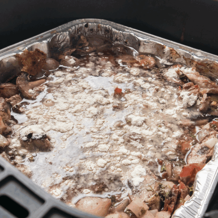 Carrots, potatoes, and onions arranged around tasteful pot roast with beef broth and Worcestershire sauce.