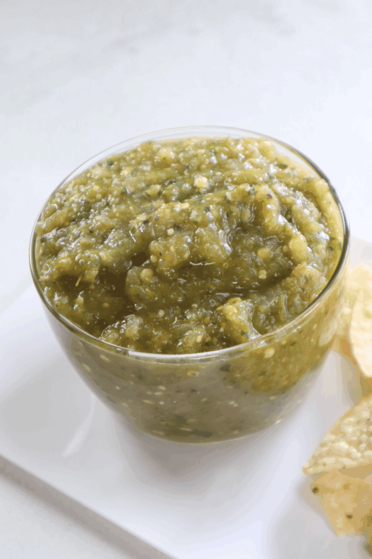 Homemade Copycat Abuelo’s Fresh Tomatillo Salsa served in a bowl with tortilla chips.
