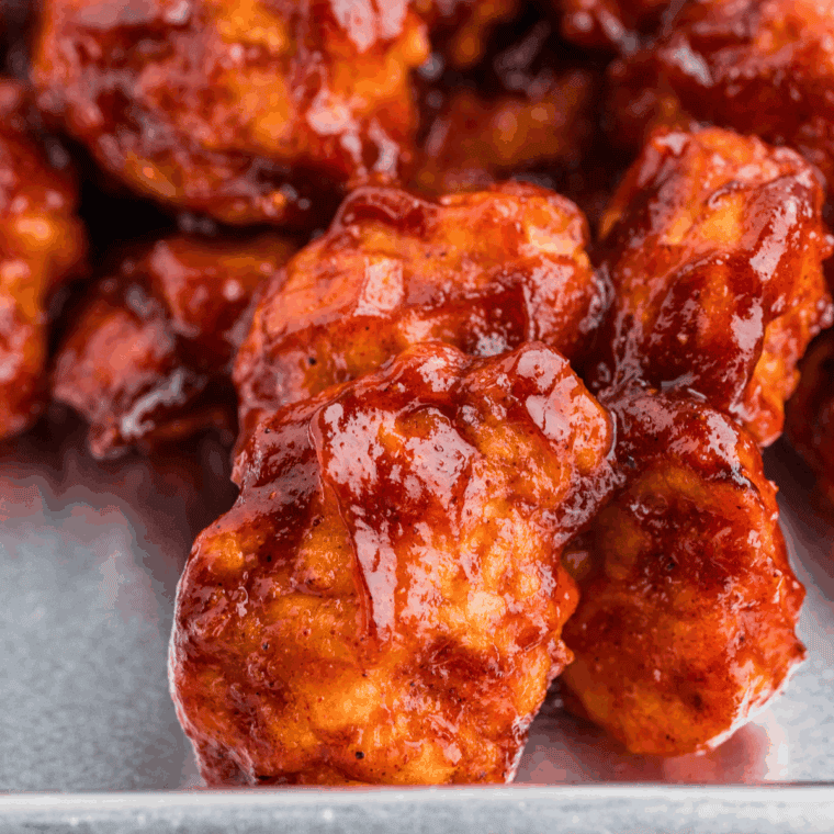 Homemade Dairy Queen-style BBQ sauce in a small bowl with a spoon ready to serve