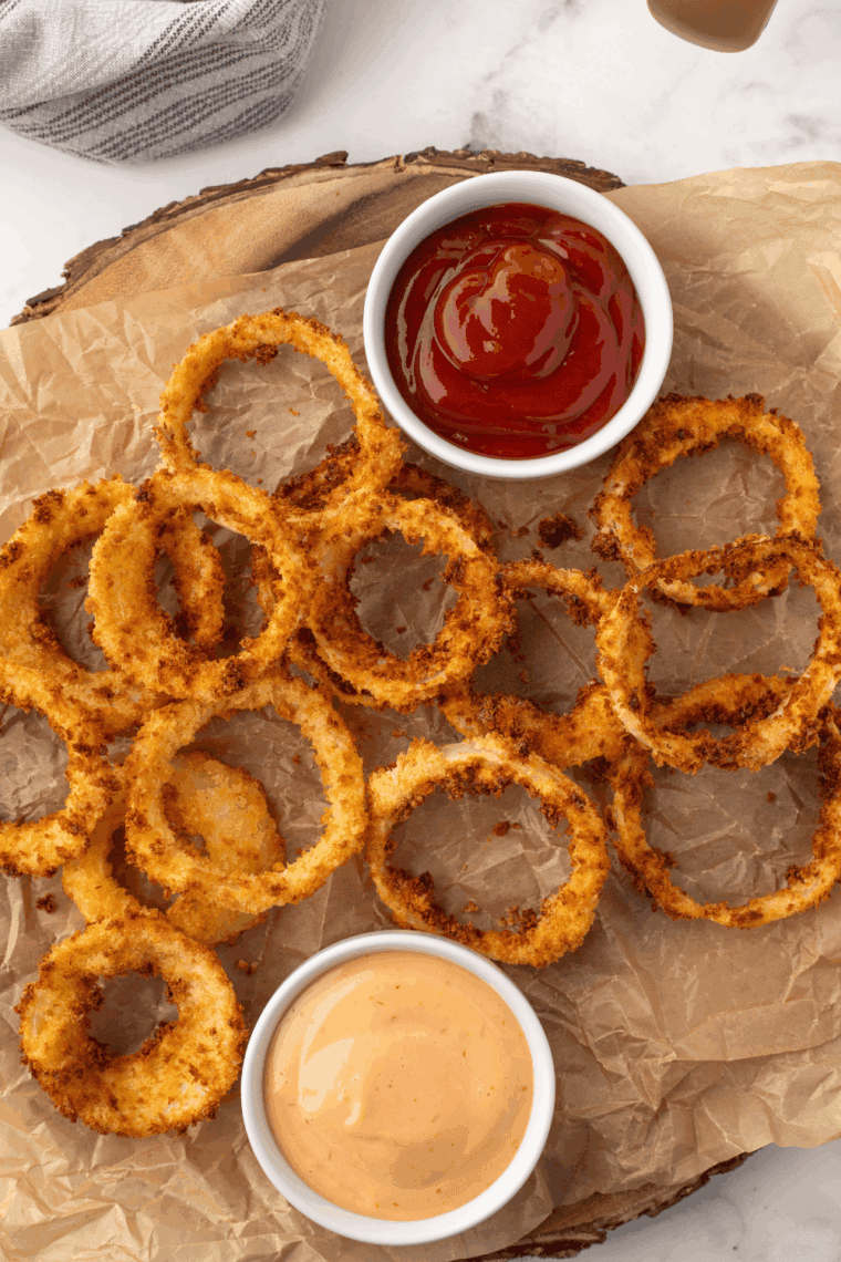Copycat Dairy Queen Brazier Burger Sauce in a small dipping bowl next to a juicy burger and fries.