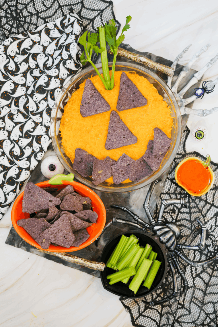 Halloween Boo-falo Wing Dip served warm in a festive dish with chips for dipping.