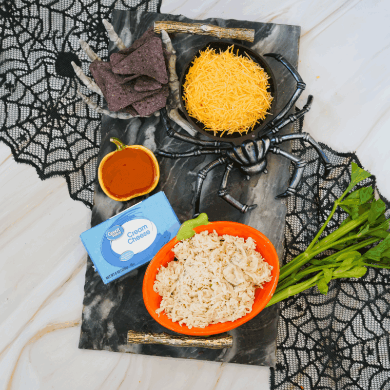 Ingredients needed for Halloween Boo-falo Wing Dip Recipeon kitchen table.