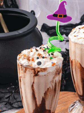 Colorful Hocus Pocus milkshake topped with whipped cream and sprinkles.