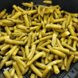 Tender, seasoned Long John Silver’s-style green beans served hot in a skillet.