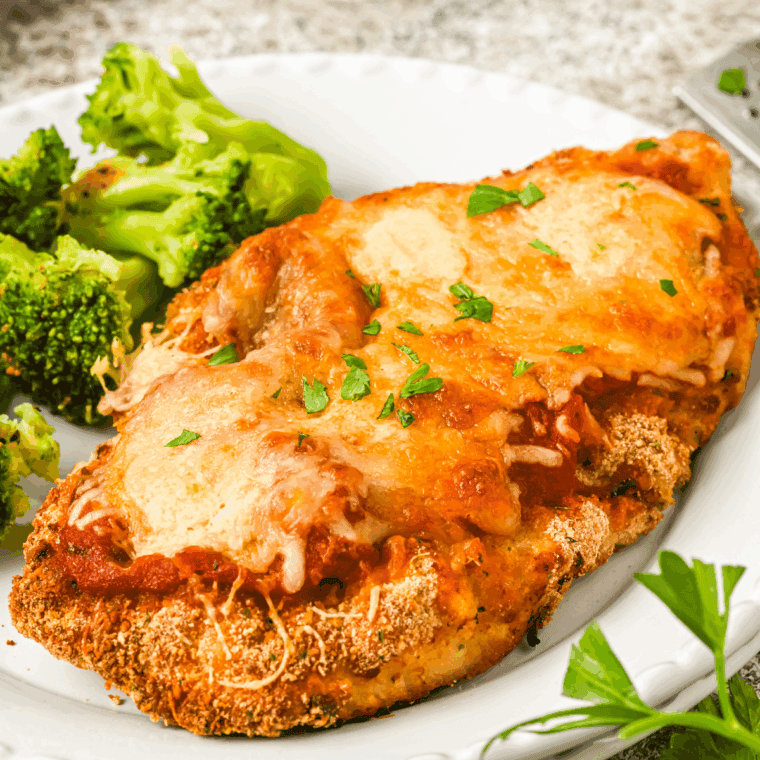 Barefoot Contessa Chicken Parmesan recipe with crispy breaded chicken topped with marinara sauce and melted mozzarella.
