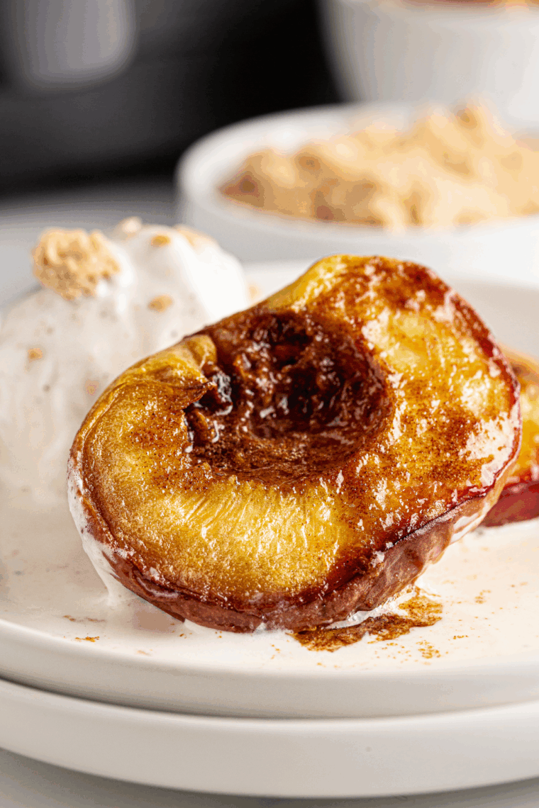 Creamy brown sugar cinnamon cream cheese in a bowl with a spoon for spreading.