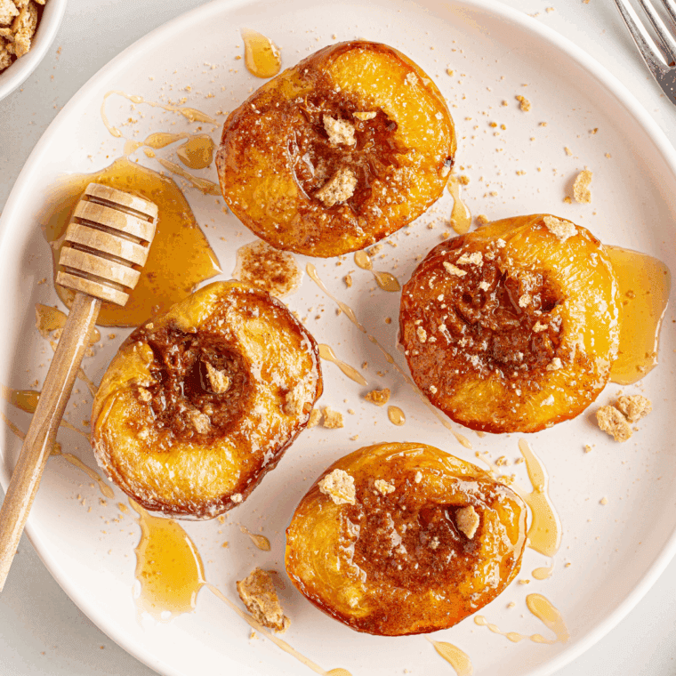 Bowl of creamy brown sugar cinnamon cream cheese with a spoon ready to spread.