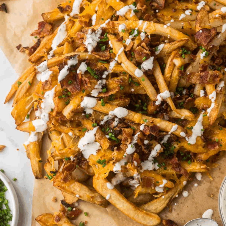 Homemade Cheesecake Factory Ranch Dressing in a bowl with a spoon, creamy and fresh, ready to serve.