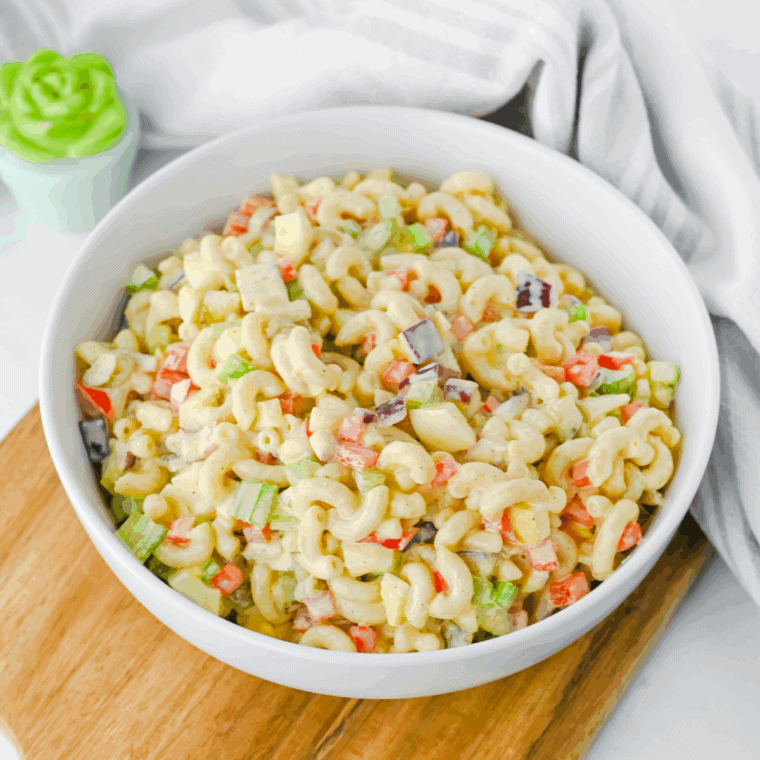 Bowl of Gordon Ramsay macaroni salad with colorful vegetables and creamy dressing.