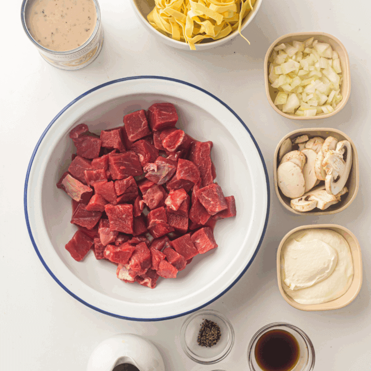 Ingredients needed for Ina Garten's Beef Stroganoff on kitchen table.