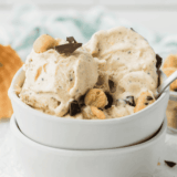 Ninja Creami Baskin Robbins copycat cookie dough ice cream with creamy vanilla base and chocolate chip cookie dough pieces in a bowl.
