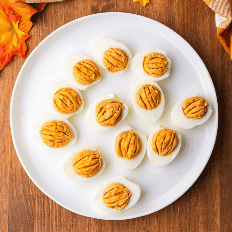 Creamy deviled egg filling tinted orange with paprika