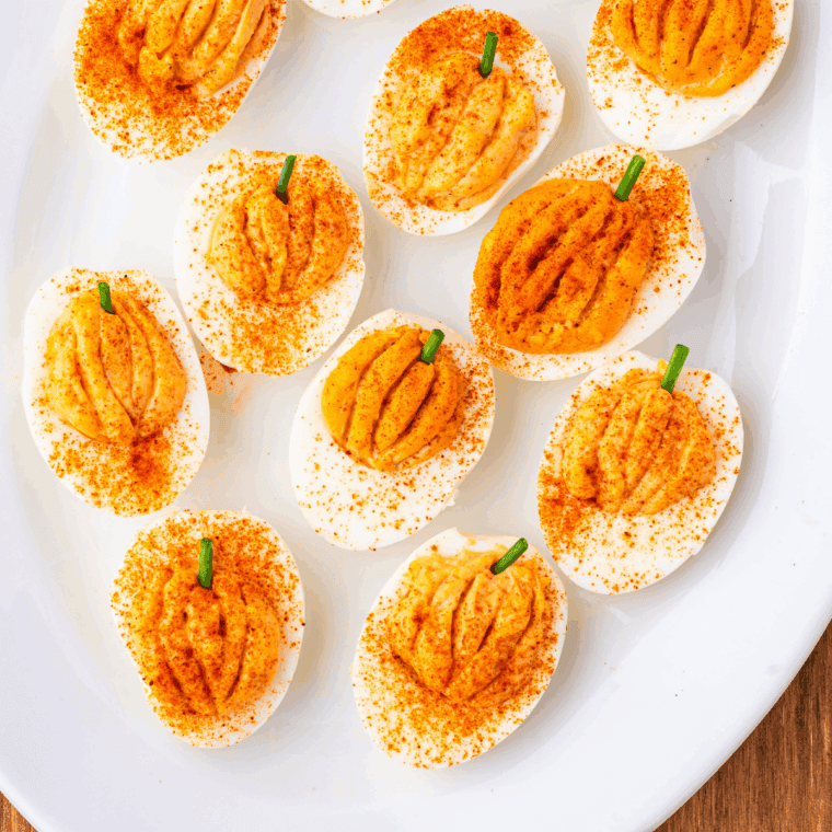 Scoring pumpkin ridges into the filling with a toothpick