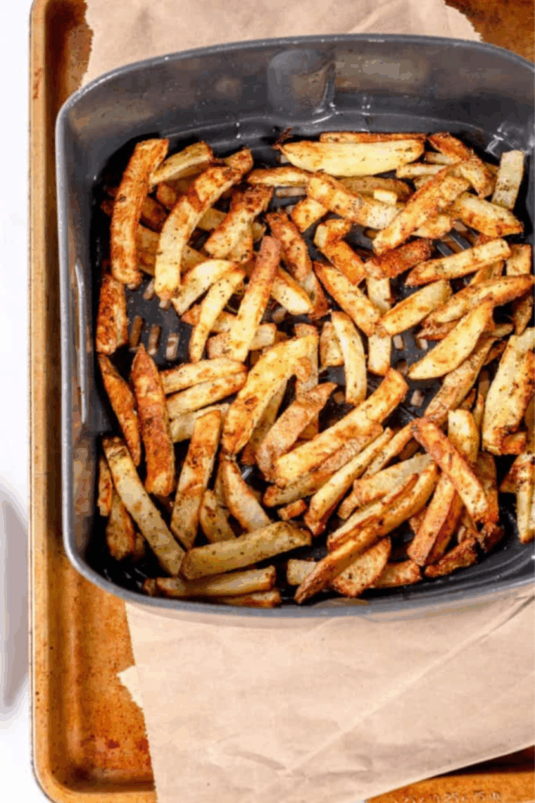 Fries in air fryer basket, no smoking.
