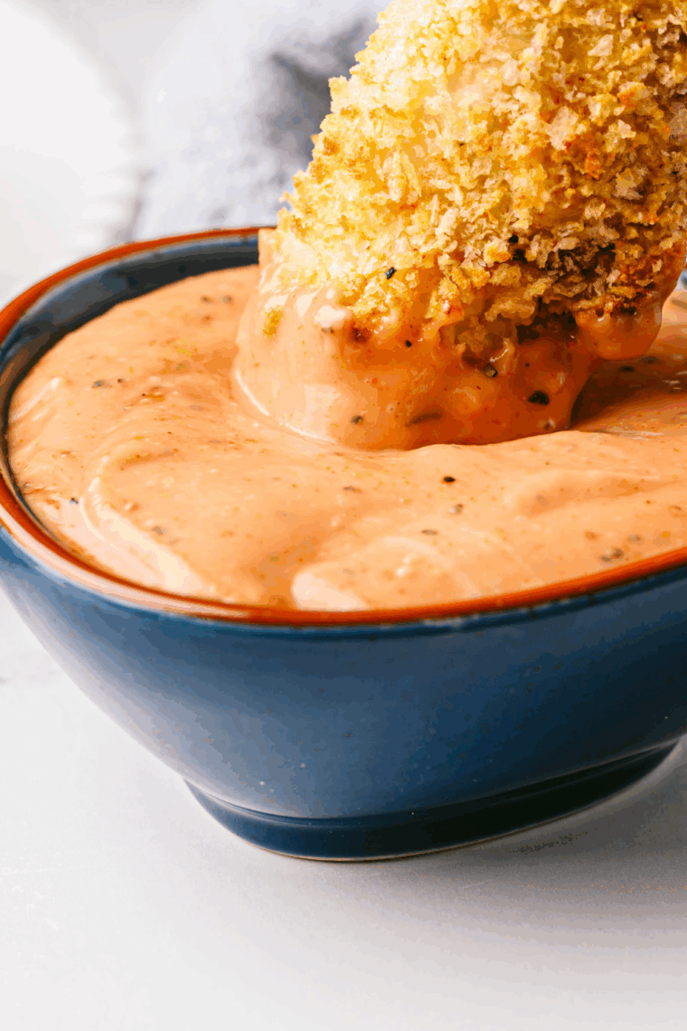 Copycat Wendy’s signature sauce in a small bowl with fries and burger