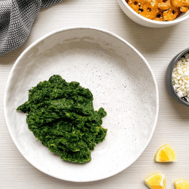 Ingredients needed for Creamy Spanakopita Dip on kitchen table.