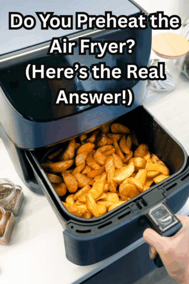 “Air fryer basket being preheated before cooking food”