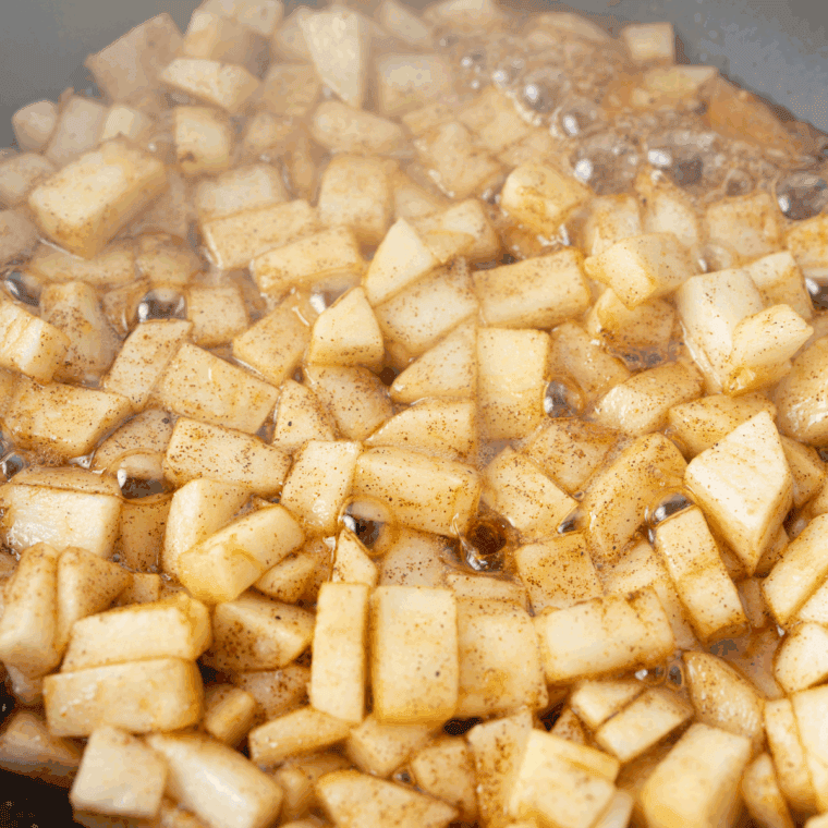 Prepare the Apple Filling: Apples, butter, brown sugar, and cinnamon cooking in a small skillet until softened.