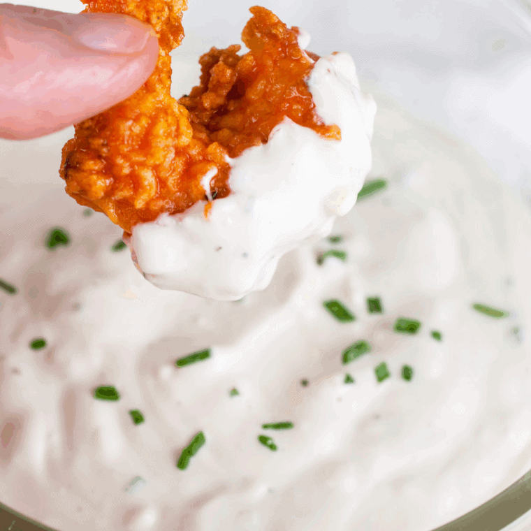 Bowl of Easy Copycat Jason's Deli Ranch Dressing Recipe on kitchen table.