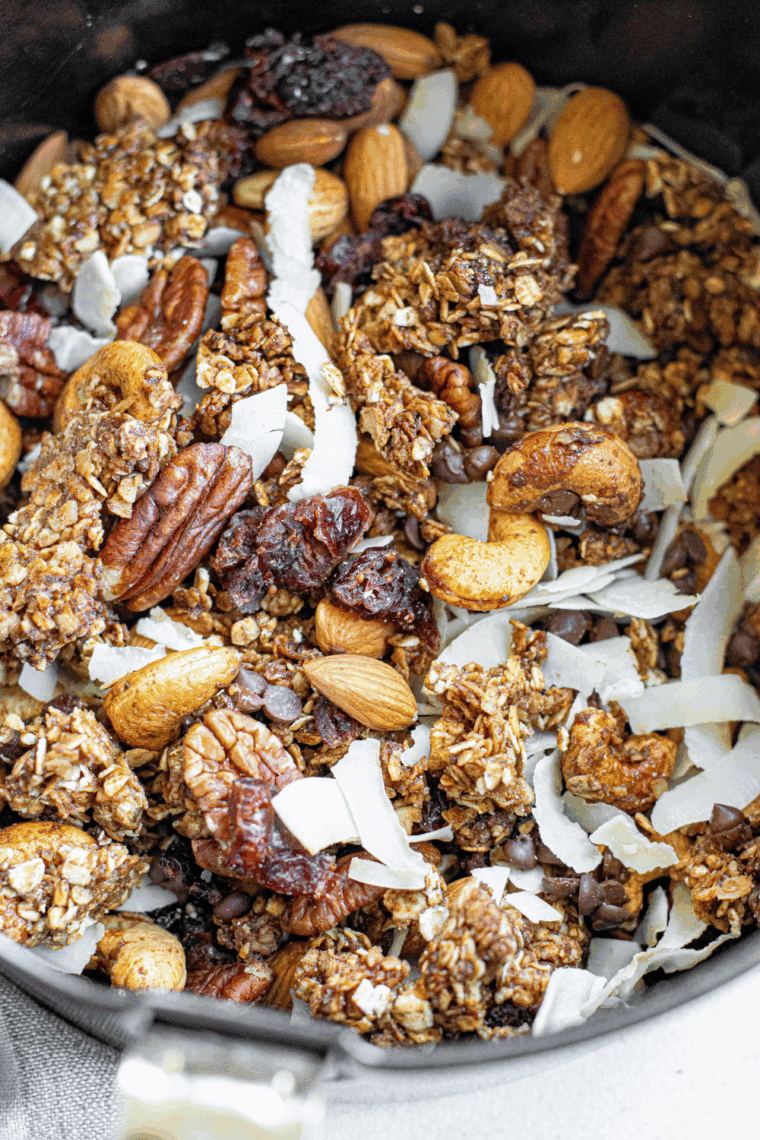 Make your own First Watch Copycat Granola at home! Crunchy clusters of oats, nuts, and seeds lightly sweetened with maple and agave syrup. Perfect for breakfast, yogurt, or snacks.