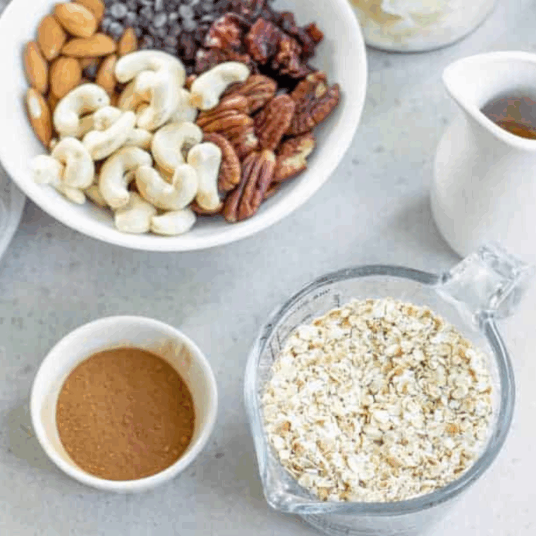 Ingredients needed for Easy First Watch Copycat Granola Recipe on kitchen table.