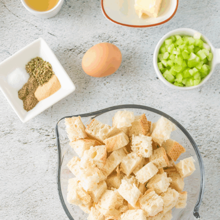 Ingredients needed for This easy Ina Garten Sausage and Herb Stuffing is. on kitchen table.