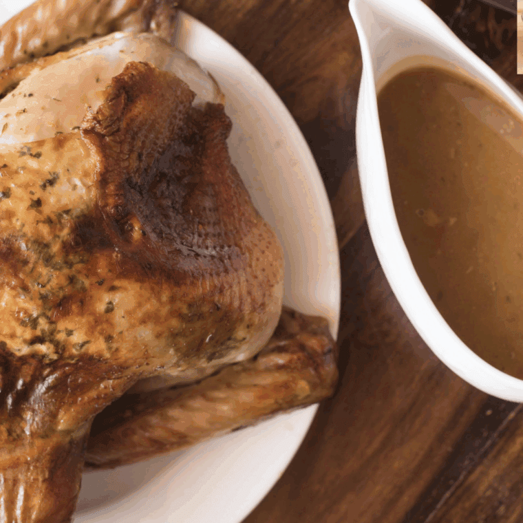 Whisking rich, smooth turkey gravy made from pan drippings in a saucepan, ready to serve.